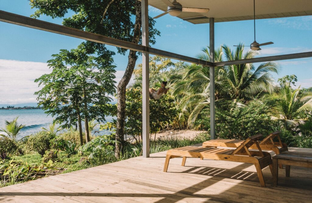 Beachfront property in Panama surrounded by palm trees, representing lifestyle and investment opportunities related to taxation in Panama.