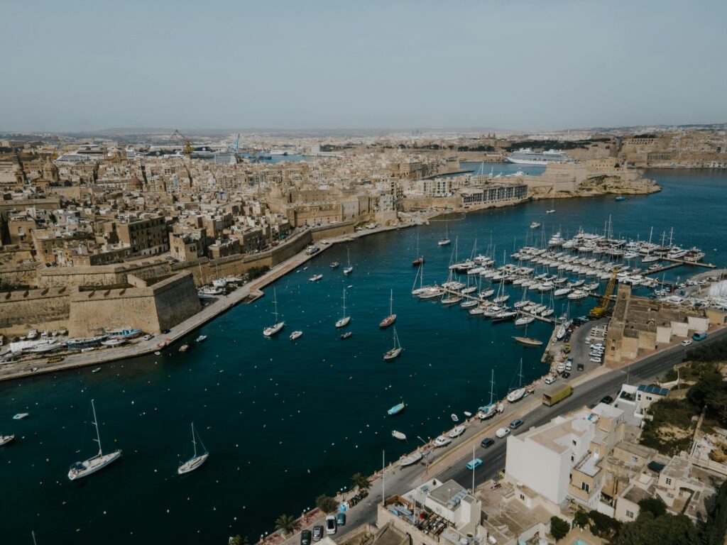 Scenic aerial view of Valletta’s historic harbour in Malta, symbolizing the country’s vibrant economy and business opportunities tied to taxation in Malta