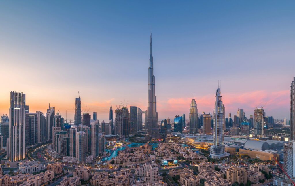 Aerial view of Downtown Dubai skyline with the Burj Khalifa at sunset — symbolizing the UAE’s residence visa options and its tax-free lifestyle for entrepreneurs and global investors