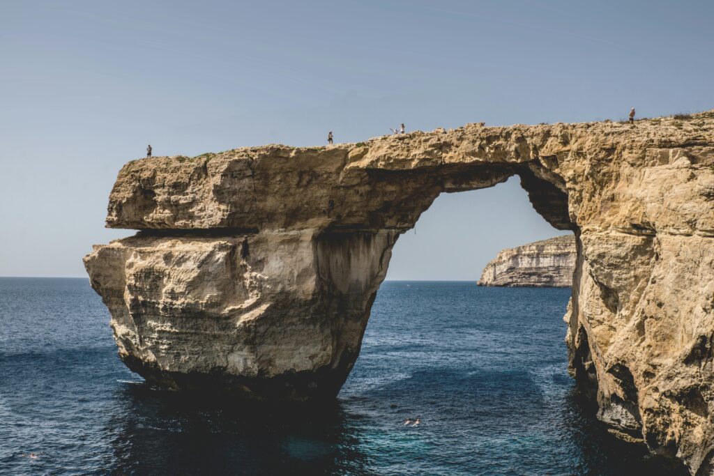 Stunning cliffs of Malta overlooking the Mediterranean Sea, a perfect backdrop for Malta Non-dom residents enjoying a tax-efficient lifestyle in paradise