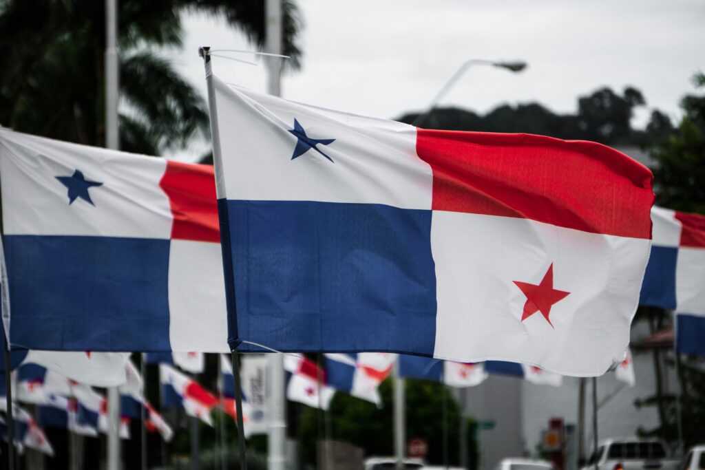 Panamanian flags representing legal stability, territorial tax system, and Panama Foundations