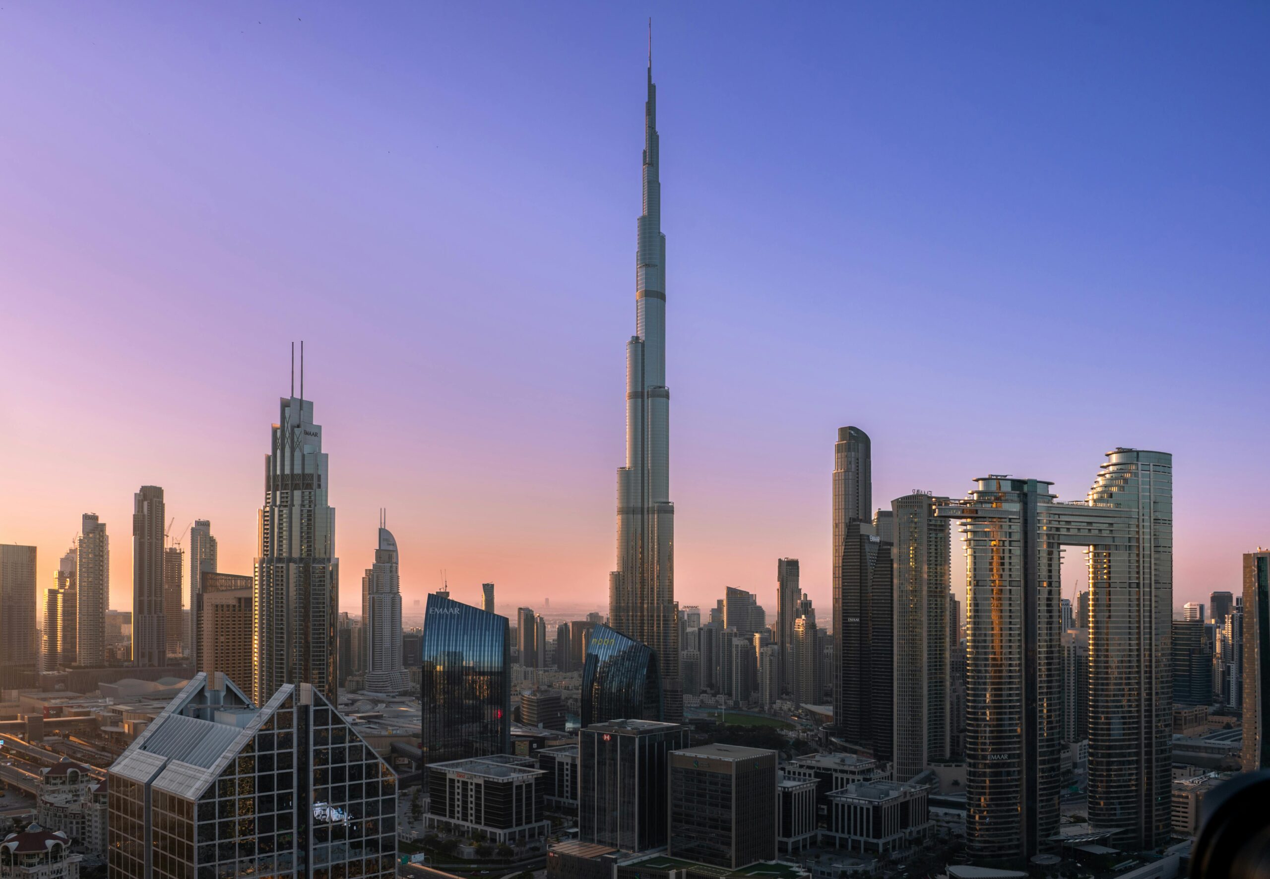 Dubai skyline featuring Burj Khalifa at sunset with modern skyscrapers