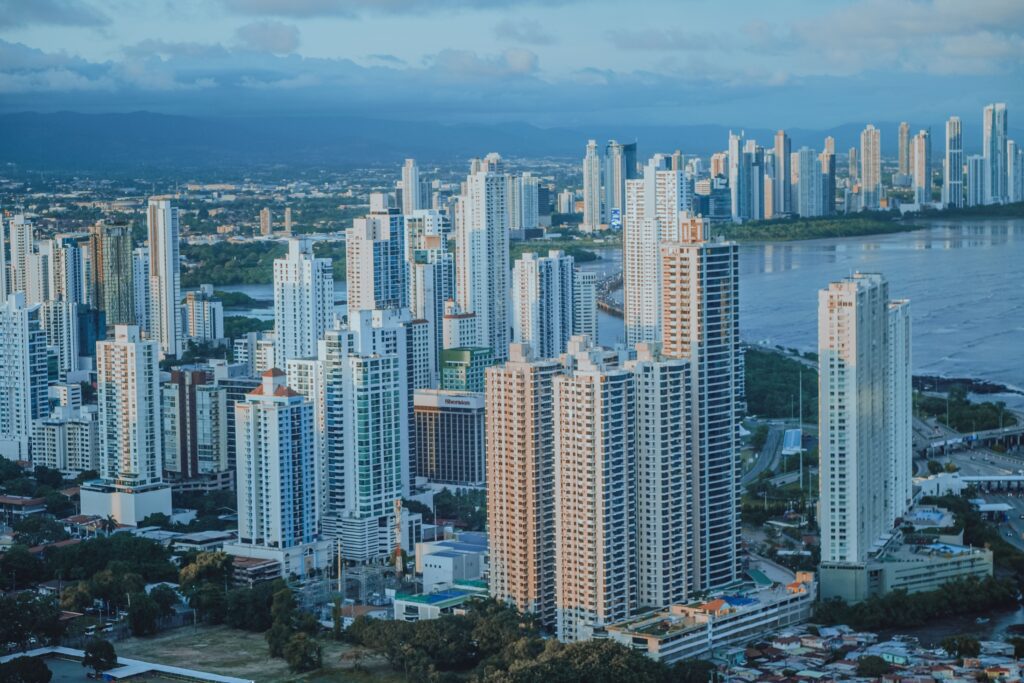 Panama City skyline by the coast, representing Panama as a long-term second passport and territorial tax option.