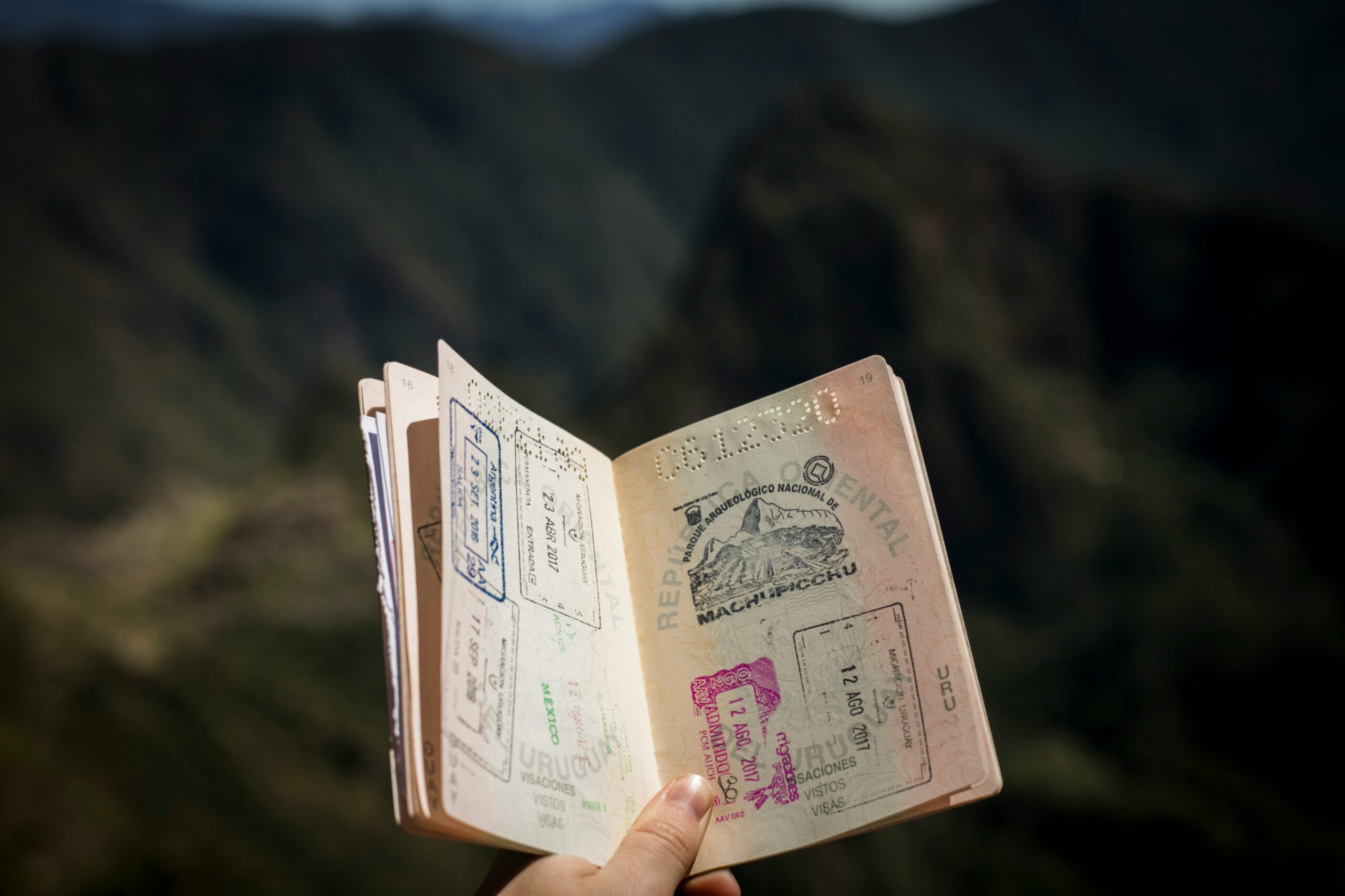 Open passport with international travel stamps, representing global mobility and the benefits of a second passport.