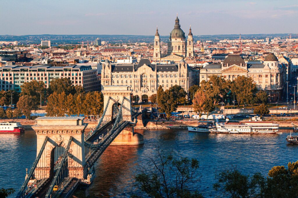 Chain Bridge over the Danube at sunset with Budapest skyline and basilica