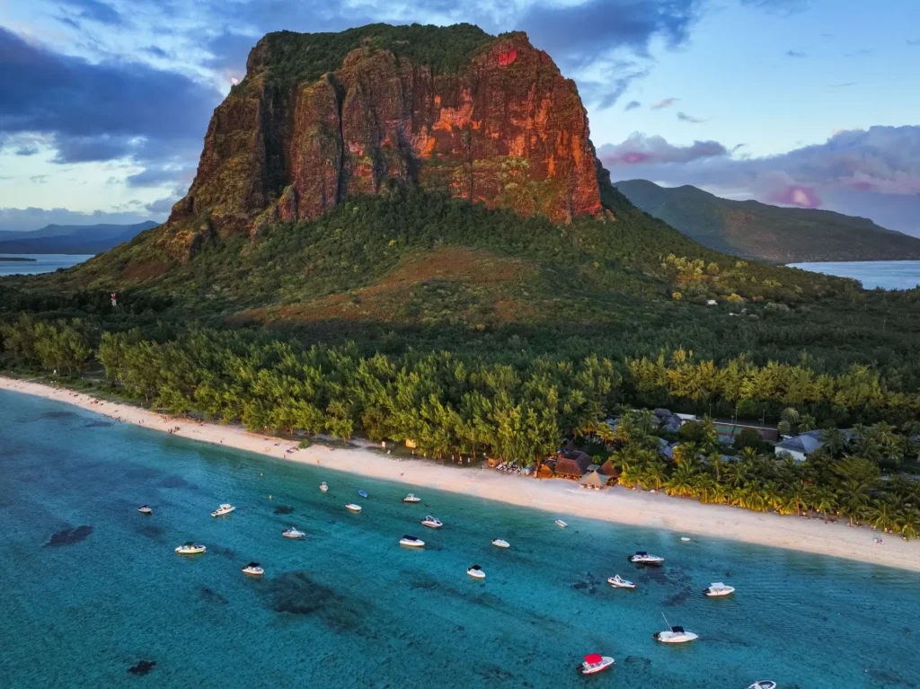 Le Morne Brabant mountain above a white sand beach and turquoise lagoon in Mauritius