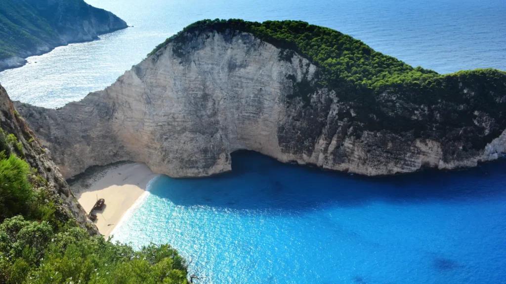 Navagio shipwreck beach with turquoise water and white cliffs in Zakynthos